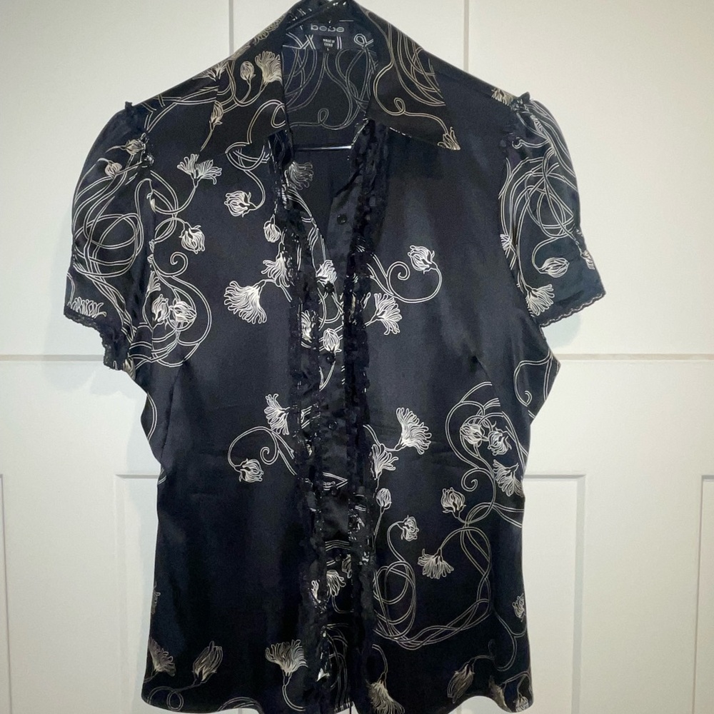 Bebe Elegant Black Stretch Silk Blouse with White Floral Design